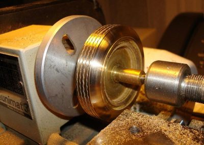 Cutting the tire tread into the brass master.