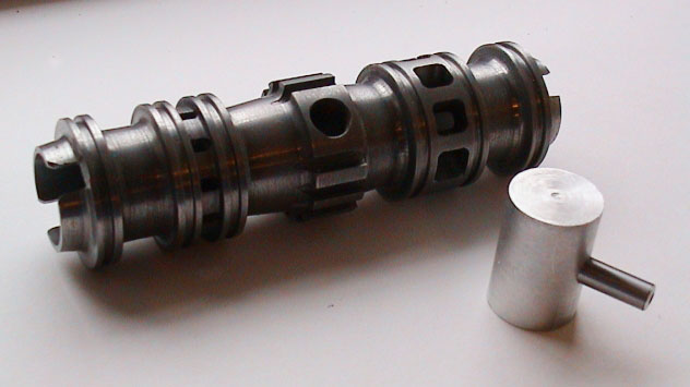 Deltic Cylinder Liner A cylinder liner is shown with a dummy piston.