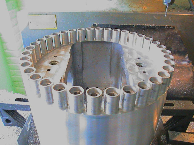 Deltic Engine Pistons In this photo, 36 small Deltic pistons sit atop a full-size Paxman piston skirt