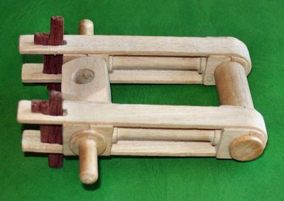 The wooden pivoting drive mechanism that mounts to the end of the beam.