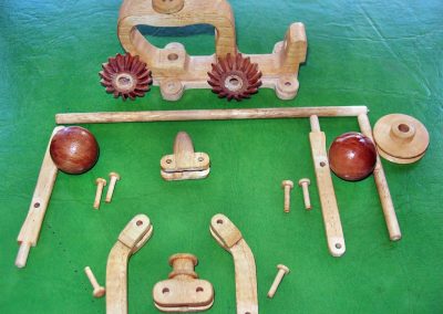 The unassembled parts for the flyball regulator mechanism and drive gears.