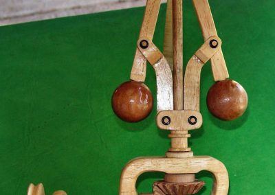 The assembled wooden flyball regulator mechanism and drive gears.
