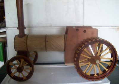 The boiler and smokestack are in place and sitting on the axles and wheels.