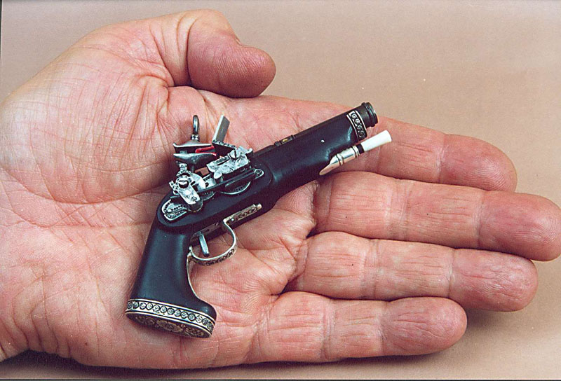 Miniature Miquelet Pistol Antonio holds his miniature Spanish Miquelet pistol.