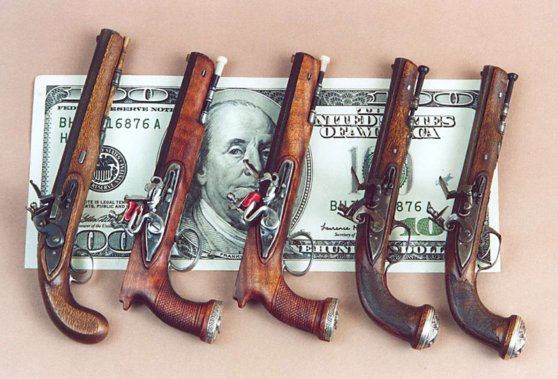 Various Flintlock Pistols Miniature Wogdon, Manton, and Boutet flintlock dueling pistols.