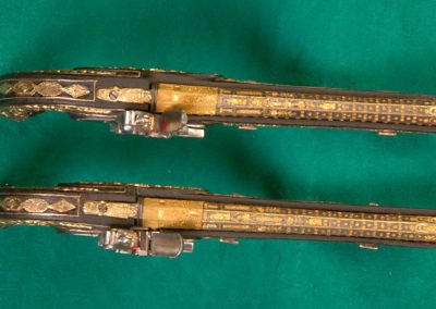 An ornate set of 1/3 scale Boutet dueling pistols.