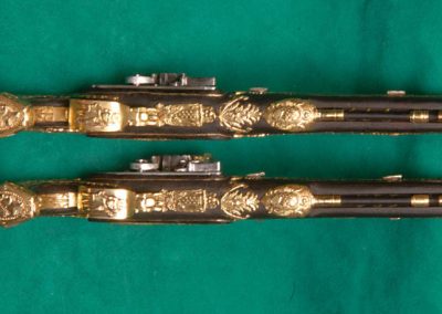 An ornate set of 1/3 scale Boutet dueling pistols.