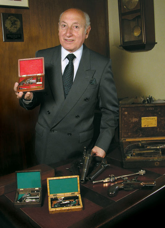 Antonio Rincón With His Firearms Antonio Rincón displays a portion of his collection.