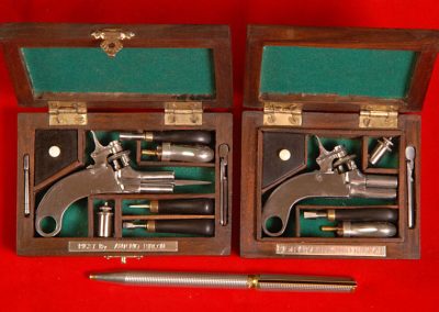 Both Rigby pistols are shown here.