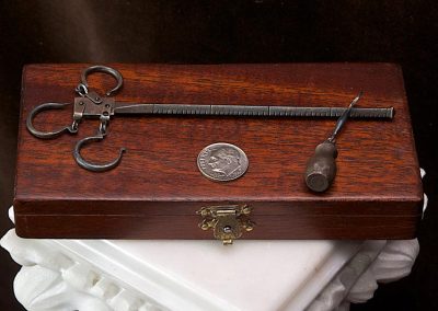 A miniature sliding weight scale made by Antonio.