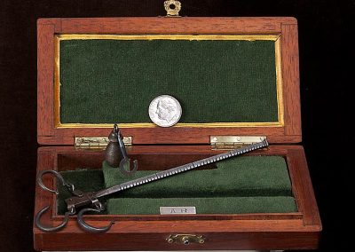 A miniature sliding weight scale made by Antonio.