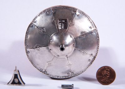 A miniature pistol shield from the Royal Armory of Henry VIII.
