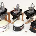 Three AMPS model racing outboard motors. The Johnson F1 with .65 OS engine is on the left. The Evinrude F1 with .45 OS engine is in the center. The Mercury EFI F1 with .45 K&B powerplant is on the right.