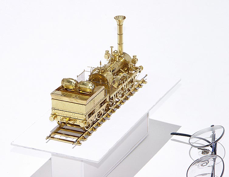 A very delicate brass sculpture of the 1835 Adler steam locomotive and tender.