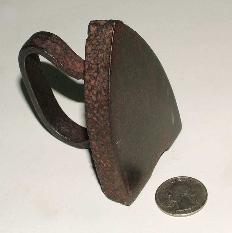 This miniature child's iron dates back over a century, if not more.