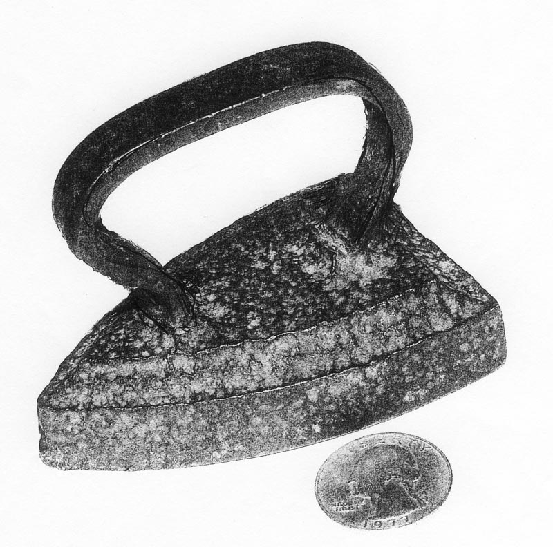 This miniature child's iron dates back over a century, if not more.