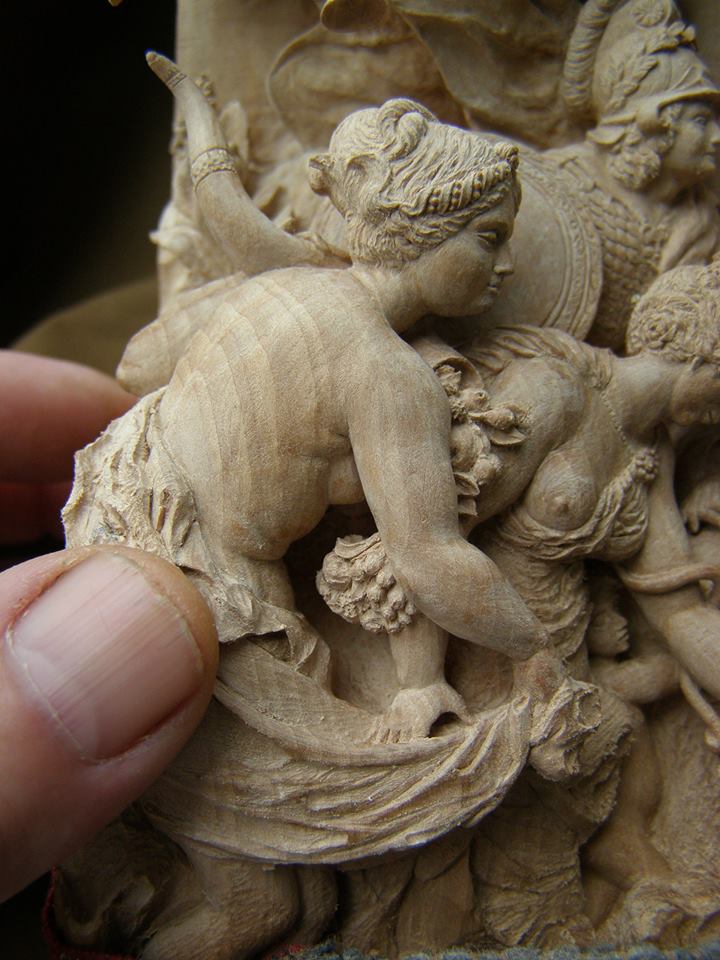 Wood Carving Close-up With a fingertip in the foreground for scale reference, this close-up illustrates just how fine the features have been made.