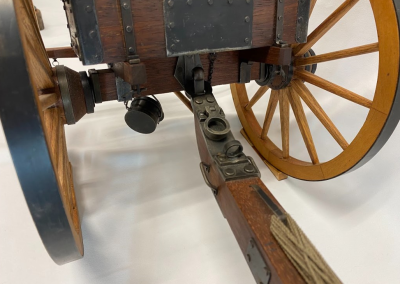 A close-up shows the lower part of the limber where the Napoleon gun is attached for towing.