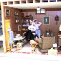 This 1/12 scale dollhouse room is styled as a 1950s basement apartment.