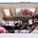 This tiny 1/12 scale dress shop is packed with all the latest styles.