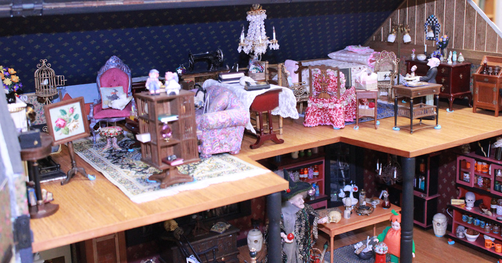 This 1/12 scale 2-story dollhouse is called, “Witch’s House.” A few miniature trick-or-treaters can be seen daring to approach the wrinkled witch.