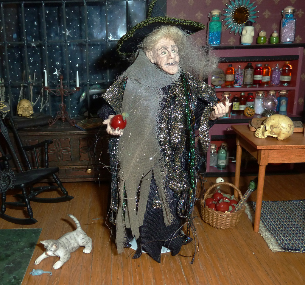 This 1/12 scale 2-story dollhouse is called, “Witch’s House.” A few miniature trick-or-treaters can be seen daring to approach the wrinkled witch.