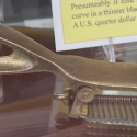 This brass rasp holder is used or woodworking. 