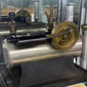 This toy steam plant consists of an electrically heated boiler to produce steam to power a small engine.