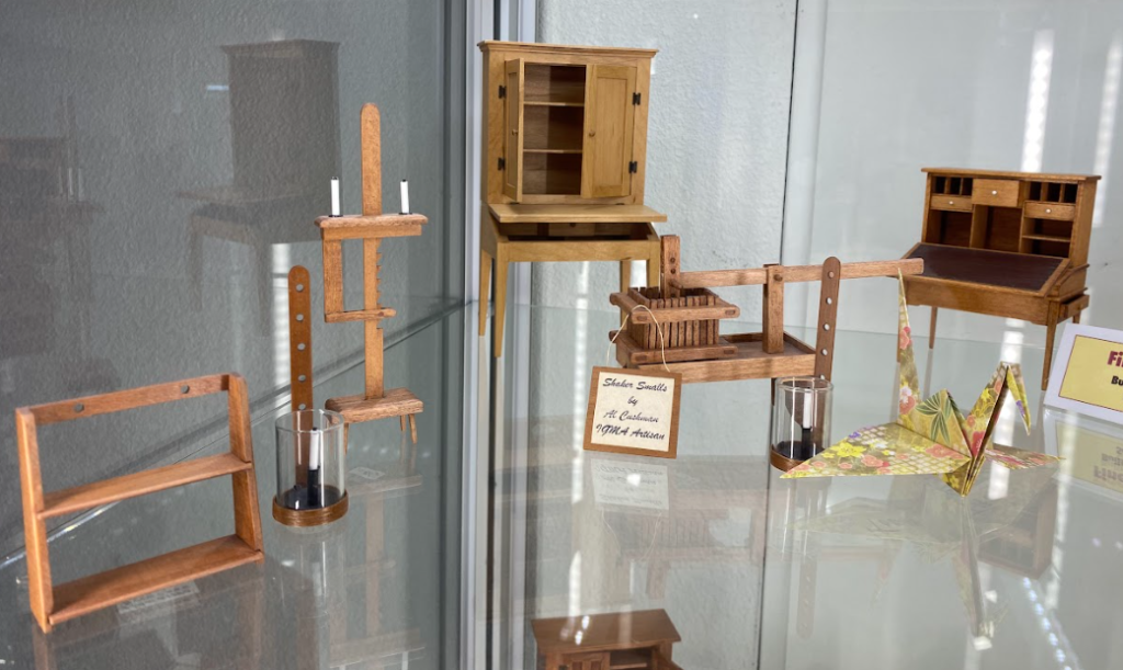 Several pieces of fine 1/12 scale miniature furniture crafted by Al Cushman.