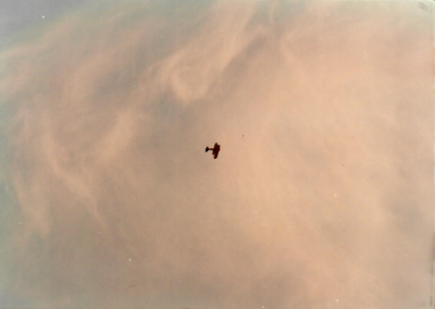 Another shot the biplane high in the sky.