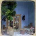 Peggy Boggeln built this side patio dollhouse at 1/4”-scale for a class at a NAME convention.