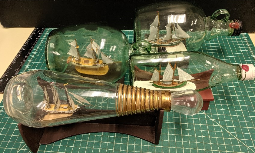 Four Handmade Ships in Bottles
