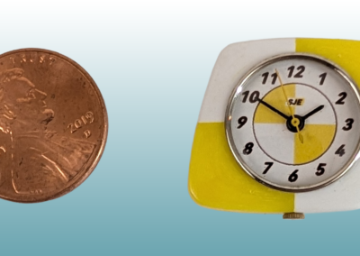Asymmetric Kitchen Clock. Materials: Plastic 4 part case (ABS), plastic back cove (PLA), nickel plated brass bezel, brass dial plate, glass. 1x1x.25