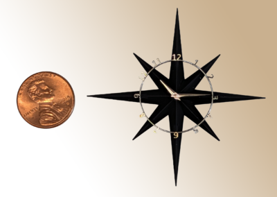 Eight Point Starburst Clock. Materials: Plastic body and movement holder (PLA), stainless steel numbers ring with nickel numbers. 2.3x2.3x.35
