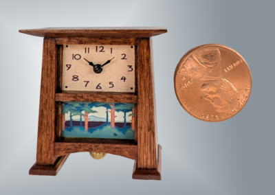 Craftsman Clock. Materials: Stained Alder case, plastic movement holder (ABS), brass dial plate, fittings and bob. 1.1x1.2x.5. (All dimensions are in inches, WxHxT.)