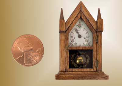 Steeple Clock. Materials: Stained alder case, plastic movement holder. Brass dial plate, hinges, knob and bob. Glass. 1x1.6x.45